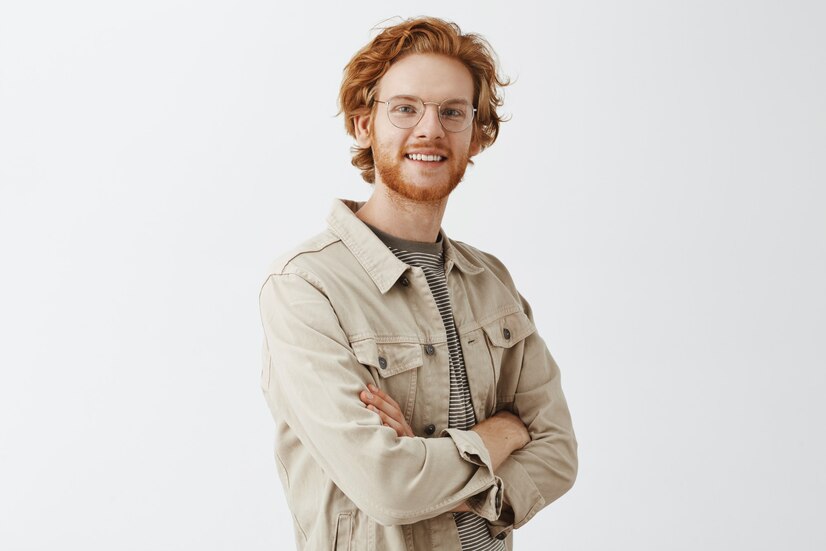 expressive-redhead-guy-beige-shirt_176420-32329